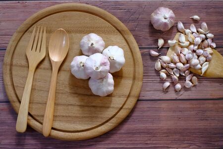 White garlic on the wood floorの写真素材