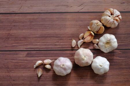 Fresh white garlic from the farm on the wooden floorの写真素材