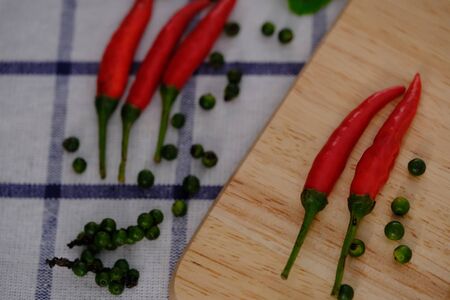 Red peppers on the wood floorの写真素材