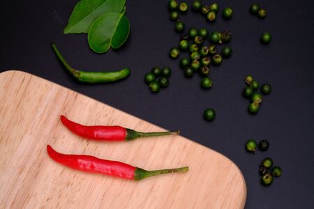 Red peppers on the wood floor in the kitchen