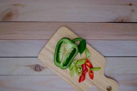 Red green chillies on the wood floor