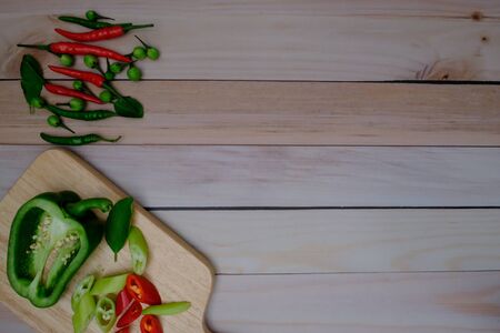 Red green chillies on the wood floorの写真素材