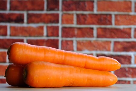 Carrots on the wooden floor in the kitchen