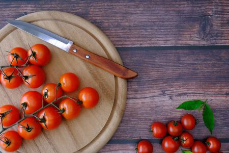 Tomatoes on the wooden floor in the kitchenの写真素材