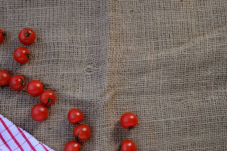 Tomatoes on the sack in the kitchenの写真素材