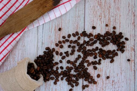 Coffee beans on the wood floorの写真素材