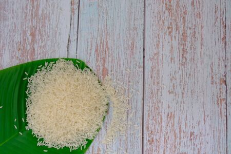 Milled rice on the wood floor in the kitchenの写真素材