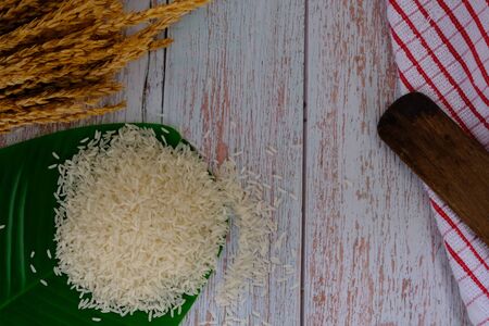 Milled rice on the wood floor in the kitchenの写真素材