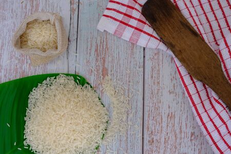 Rice on the wood flooring in the kitchenの写真素材