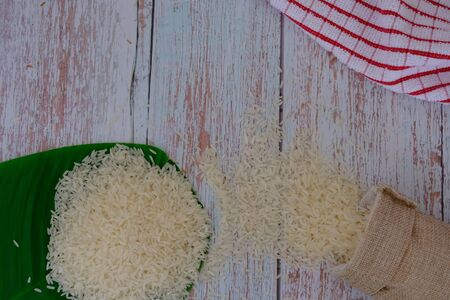 Rice on the wood flooring in the kitchenの写真素材