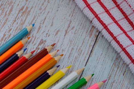 Colored pencils on the wood floorの写真素材