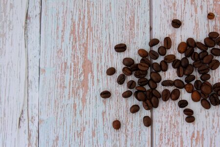 Coffee beans on the wood floorの写真素材