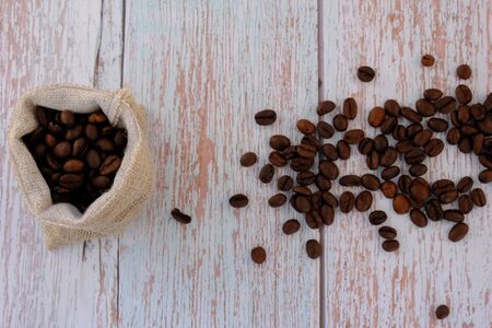 Coffee beans on the wood floorの写真素材