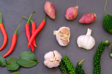 Chili, onion, garlic and spices in the kitchenの写真素材