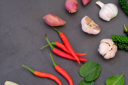 Chili, onion, garlic and spices in the kitchenの写真素材
