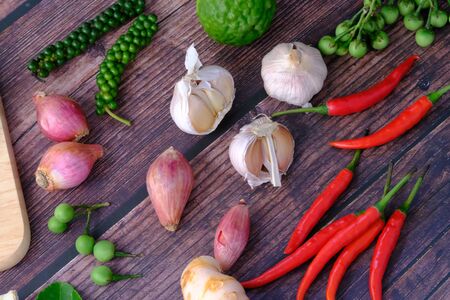 Peppers, onions, garlic and spices in the kitchenの写真素材