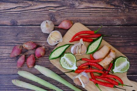 Chili, onion, garlic on the wooden floor in the kitchenの写真素材
