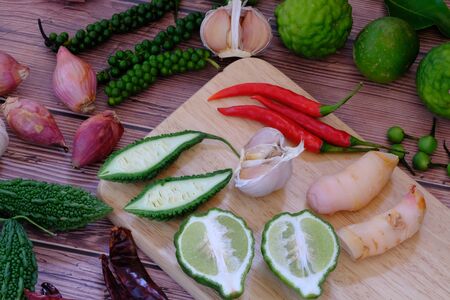 Chili, onion, garlic on the wooden floor in the kitchenの写真素材