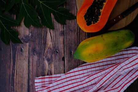 Papaya on the wooden floor in the kitchenの写真素材