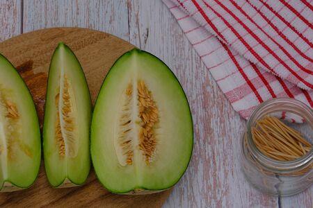 Cantaloupe on the wooden floor in the kitchenの写真素材