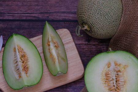 Cantaloupe on the wooden floor in the kitchenの写真素材
