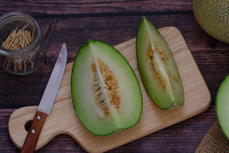 Cantaloupe on the wooden floor in the kitchenの写真素材