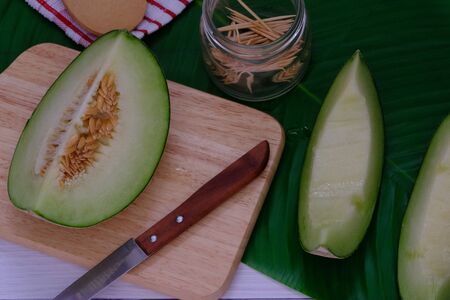 Cantaloupe on the wooden floor in the kitchenの写真素材