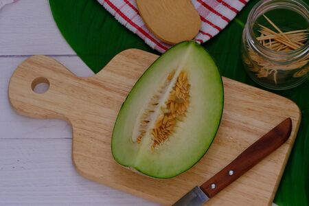 Cantaloupe on the wooden floor in the kitchenの写真素材