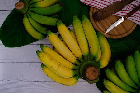 Banana on the wooden floor in the kitchen for cookingの写真素材