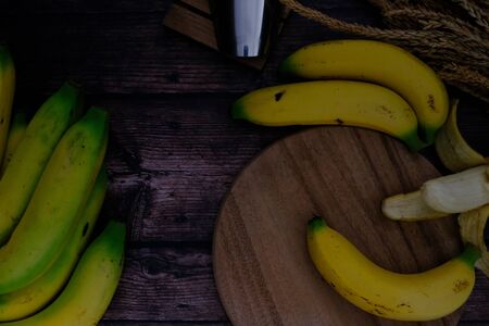 Banana on the wooden floor in the kitchen for cookingの写真素材