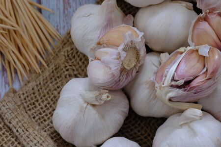 White garlic in the kitchen for cookingの写真素材