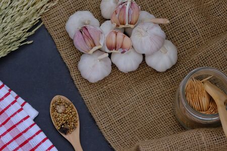 White garlic in the kitchen for cookingの写真素材