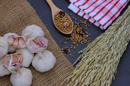 White garlic in the kitchen for cookingの写真素材