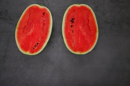Bright red watermelon from the farm in the kitchenの写真素材