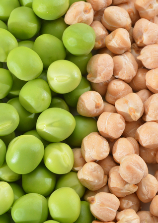 fresh green peas and chick beans isolated on background.の写真素材