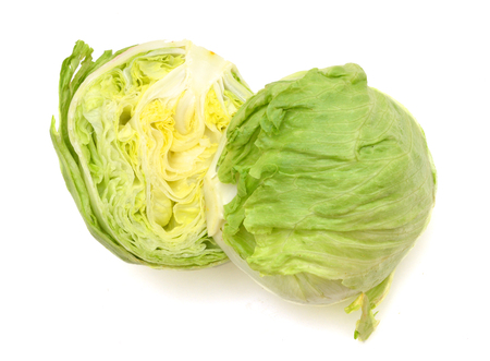 fresh iceberg salad isolated on whiteの写真素材