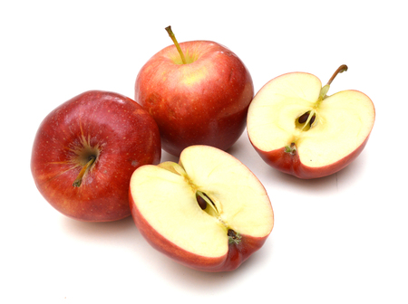 Two ripe red apples and half of apple. Isolated on a white background.の写真素材