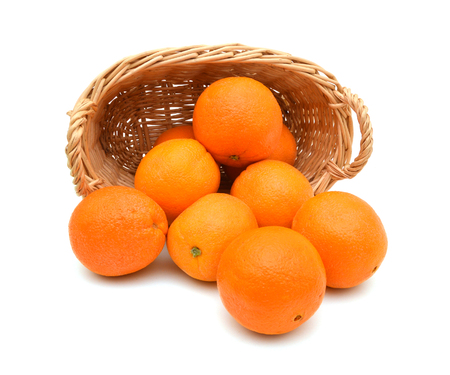 oranges in a basket on a white backgroundの写真素材