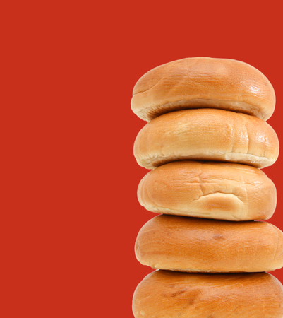bagels isolated on red backgroundの写真素材
