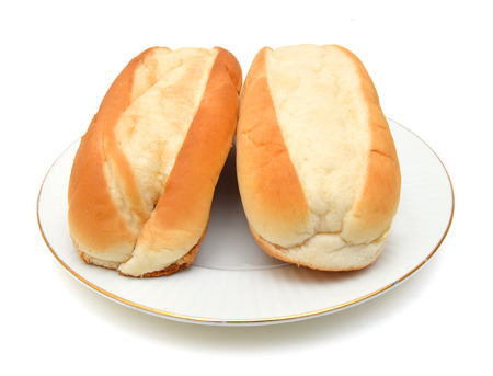 Bread buns in white plate on white