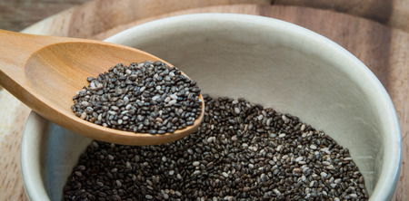 Closeup wooden spoon on Chia seed bowl.の写真素材