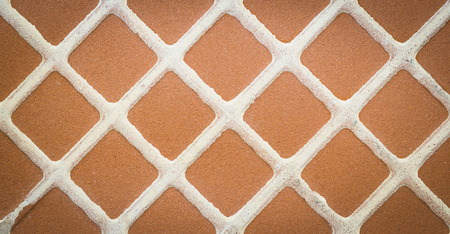 Close up brown square mosaic tile, pattern and backgroundの写真素材
