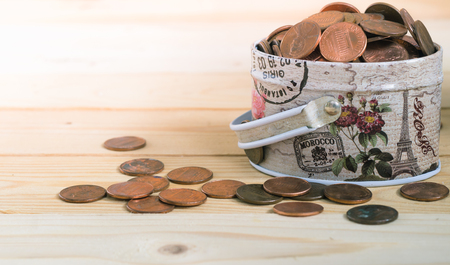 US one cents coins overflow from metal box - split toning effectの写真素材