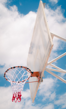 Basketball hoop with blue sky background, outdoor , street sport or recreationの写真素材