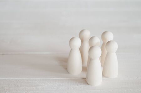 group of wooden dolls on the tableの写真素材
