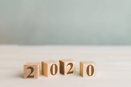 2020 words for new year or goal concept in wooden cubes on table with blur background
