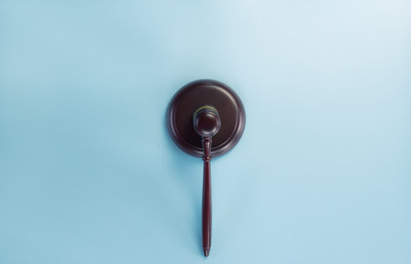 Gavel on blue background view from the top with  space for text, legislation symbol