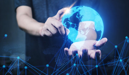 Human hold and point glow earth hologram. information and technology conceptの写真素材