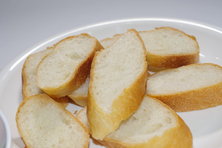 Sliced baguette on the plateの写真素材