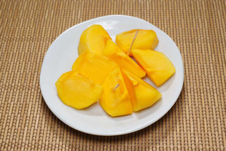 Cut persimmon fruitの写真素材